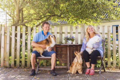 Portrait of man and woman with dogs